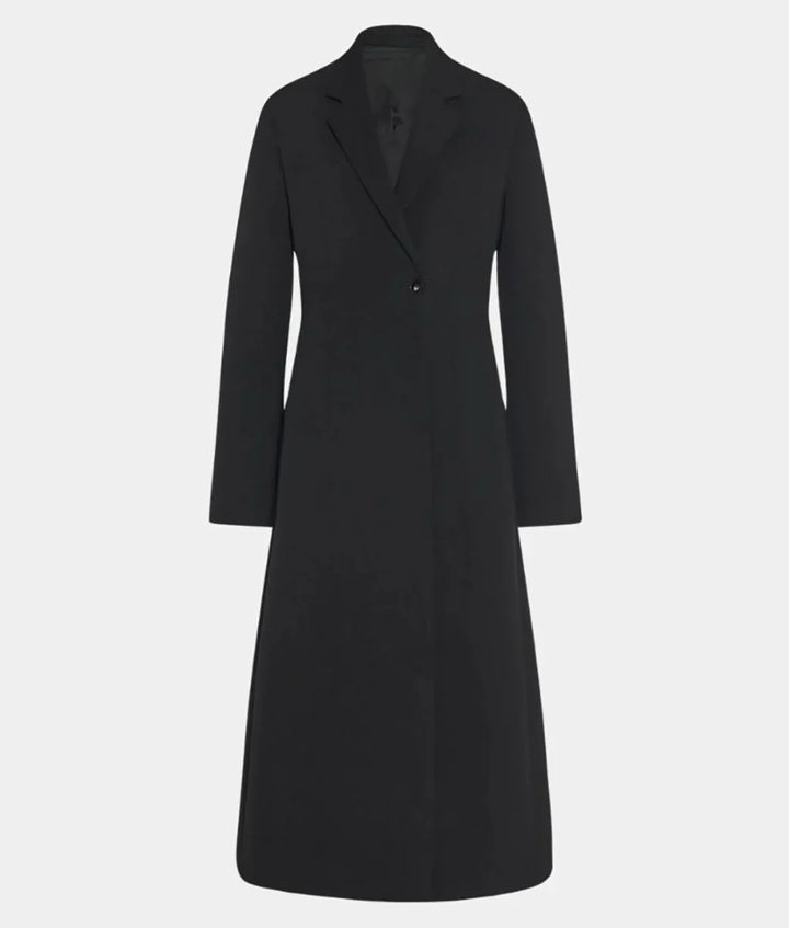 Kathryn Hahn wearing black coat in Agatha All Along 2024 in American style