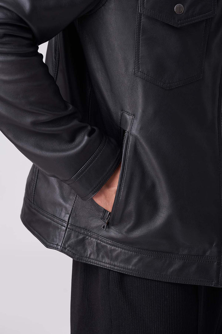 Stylish black leather jacket with buttoned pockets