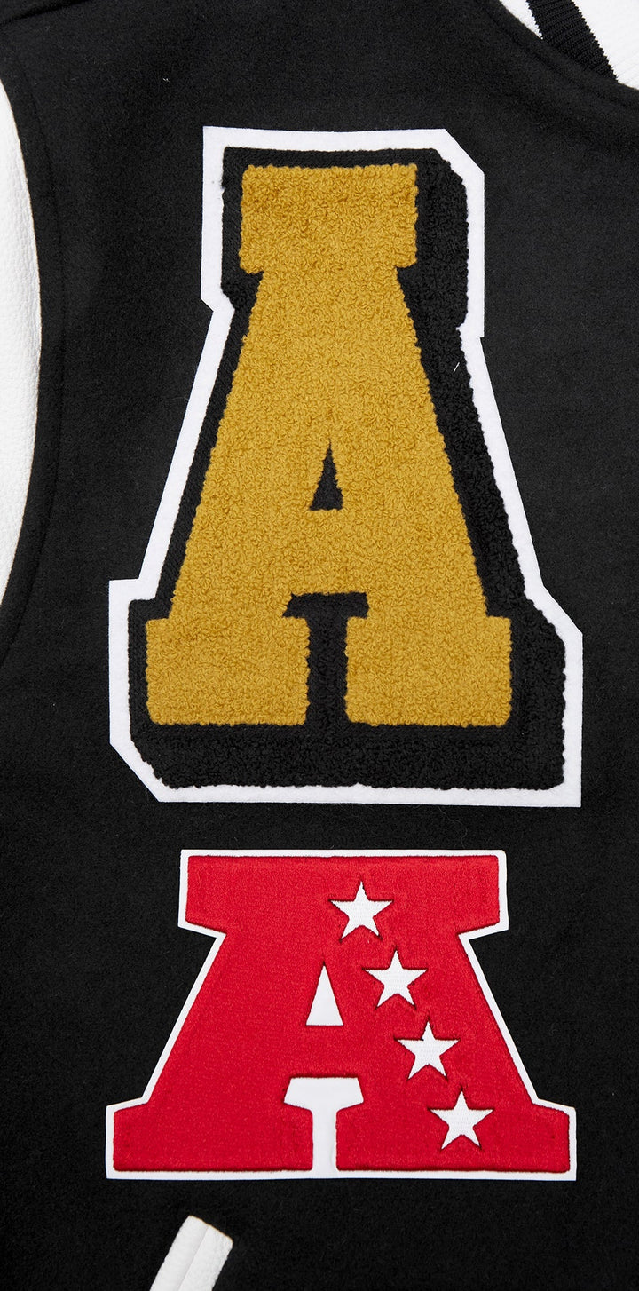 Detailed view of the Jacksonville Jaguars 'A' patch and team conference logo on the varsity jacket.