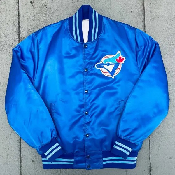 Blue jacket with a logo on a concrete surface